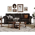 Black Leather Sofa With Pillows And Wooden Coffee Table In Living Room With Wall Art