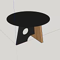 Black Round Dining Table With Geometric Black And Wooden Base On Gray Marble Floor