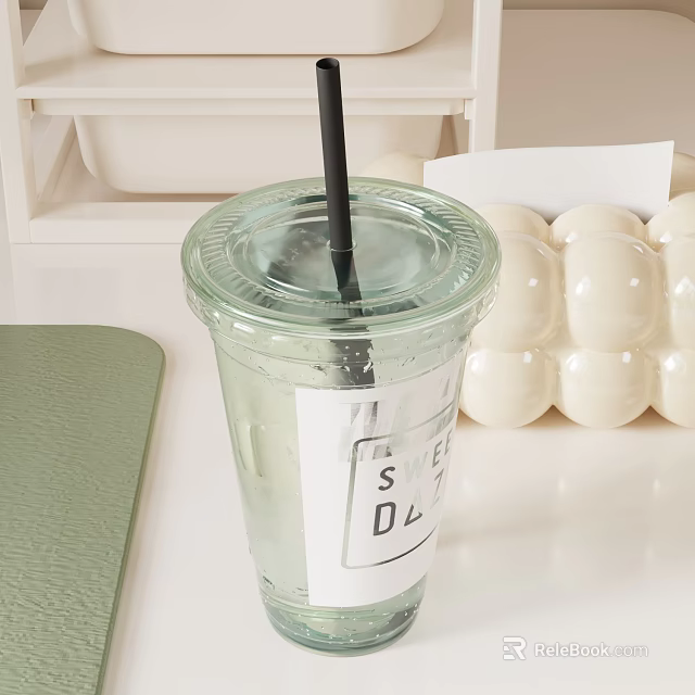 Bubble Tea Shop Clear Plastic Cup With Black Straw Label And White Boba Pearls On Green Mat 3d model 