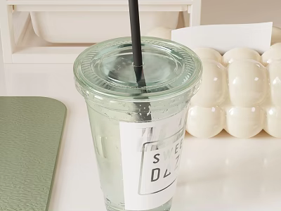 Bubble Tea Shop Clear Plastic Cup With Black Straw Label And White Boba Pearls On Green Mat 3d model