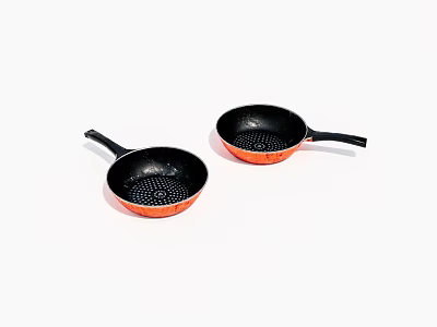 Two Non Stick Frying Pans With Black Body Orange Rim And Dot Texture Interior 3d model