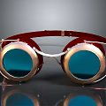 Vintage Brass Frame Goggles With Red Headband And Blue Lenses On Black Surface