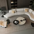 Modern Curved White Sofa And Round Coffee Table With Accent Pillows In Modern Living Room