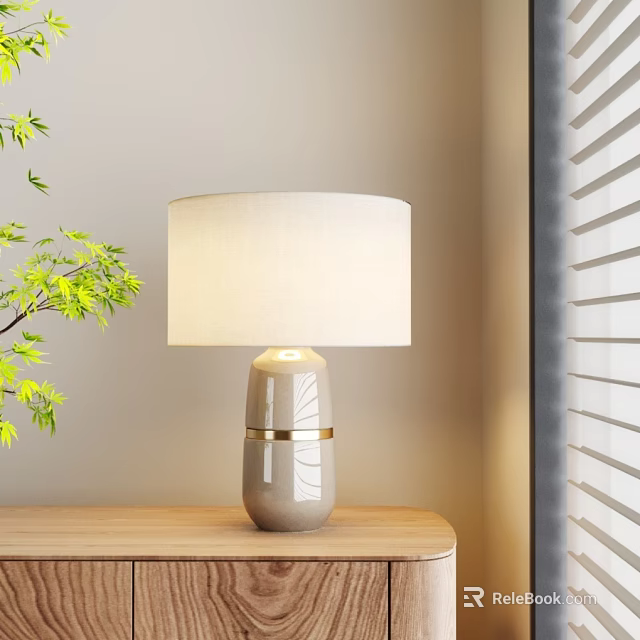 Stylish Ceramic Table Lamp With Cream Lampshade Gold Trim On Wooden Table Near Green Plant 3d model 