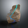 Natural Stone Decorative Ornament With Blue Luminous Veins And Textured Surface