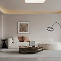 Warm Modern Minimalist Living And Dining Room With Soft Sectional Sofa And Curved Floor Lamp