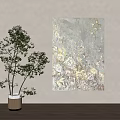 Textured Gray Floral Painting On Wall With Green Plant In Vase