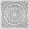 Intricate Circular Carving with Central Floral Motif and Elaborate Patterns