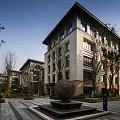 Modern Multistory Residential Exterior With Green Landscape And Leisure Seating Area