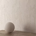 Beige Textured Wall Components With Round Object On Wooden Table