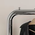 Clothes Rack with Hanging Coats Black Dresser Lamp and Sign in Modern Room Interior