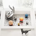 Abstract Silver Sculpture with Colorful Spheres and Black Cat in White Square Corrugated Metal Container