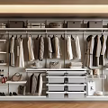 Modern Organized Closet Interior With Hanging Folded Clothes Bags Shoes Shelves And Drawers