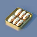 Delicious Finger Pastry with White Frosting Served on Golden Tray