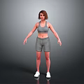 Woman in Gray Sports Bra and Shorts Standing with White Sneakers on Gray Background