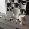 Modern Minimalist Office Setup With Desk Apple Laptop Bookshelf Books And Office Chair