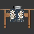 Oval Shaped Wooden Dining Table With Blue And White Patterned Tablecloth And Decorative Bowl