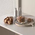 Pancakes Stacked With Syrup Banana Slices Croissants In Wooden Basket Milk Bottles On White Table