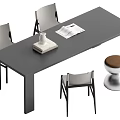Gray Dining Table Set With Four Gray Chairs Vase Books And Brown Cushioned Silver Stool