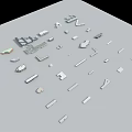 Assorted Small Metal And Plastic Components In Various Shapes On Gray Surface 3d model