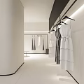 Clothing Store Interior With Hanging White Garments And Black Multi Tiered Bags Shelf