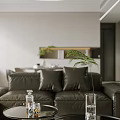 Minimalist Open Concept Living and Dining Room With Gray Sofa Green Plant And White Walls