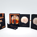 Elegant Daily Living Product Packaging With Black Bags Open Box And Gold Patterns