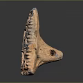 Triangular Carved Terracotta Artifact With Spiral Patterns And Hollow Decorative Design