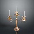 Three Arm Gold Copper Candelabra With White Candles And Ornate Base