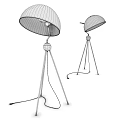 Modern Floor Lamp With Black Shade Tripod Metal Stand And Illuminated Minimalist Design