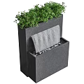 Modern Garden Accent Featuring Black Water Fountain Structure With Green Plants And Flowing Water