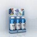 Blue Bottled Probiotic Drinks On Display Stand For Family Gathering Moments