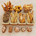 Assorted Fresh Bread Varieties Baguettes Rolls Sesame Loaves In Wicker Baskets On Light Background