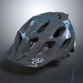 Fox Gray Mountain Bike Helmet With Blue And White Graphics And Ventilation Holes