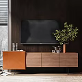 Dark Wood TV Stand With Wall Mounted TV Green Plant And Decorative Items