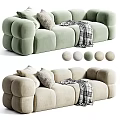 Light Green and Beige Two Seater Sofa with Pillows Plaid Blanket and Rounded Block Design