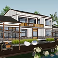 Modern Boutique Hotel Building With Waterfront View Lush Greenery And Large Glass Windows