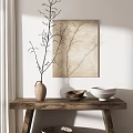Minimalist Clay Vase with Twigs on Wooden Table with Wall Art and Natural Light