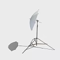 Photography Lighting Equipment Setup With Umbrella Softbox And Reflector On Tripod Stand