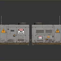 Two Industrial Gray Equipment Units With Warning Signs Metal Casings And Reflective Surface