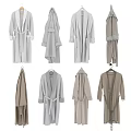 Various Light Toned Long Loose Fit Robes Hanging With Soft Fabric And Belts
