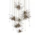 Artistic Modern Chandelier Featuring Dark Brown Flower Shaped Accents And Hanging Crystal Beads