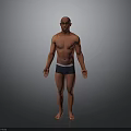Bald Head Man Standing Shirtless In Dark Shorts On Gray Background