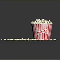 Fresh Popcorn in Red Striped Paper Cup with Scattered Pieces on Dark Background