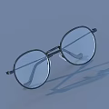 Books Magazine Featuring Round Black Frame Glasses On Light Blue Background With Shadow