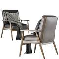 Modern Accent Chairs With Brown Black Leather Upholstery Patterned Pillows And Gray Throw Blankets