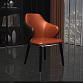 Modern Dining Chair With Orange And Gray Upholstery And Black Wooden Legs