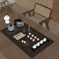 Elegant Tea Set On Wooden Table With Black Tea Tray White Vase And Woven Chair Plants