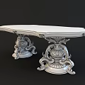 Elegant White Table With Ornate Carved Base And Intricate Decorative Pedestal Design