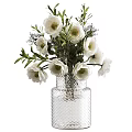 White Flowers Arrangement In Textured Glass Vase With Green Leaves And Purple Accents